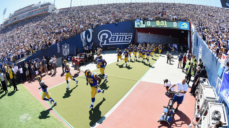 The Rams enter the Los Angeles Coliseum