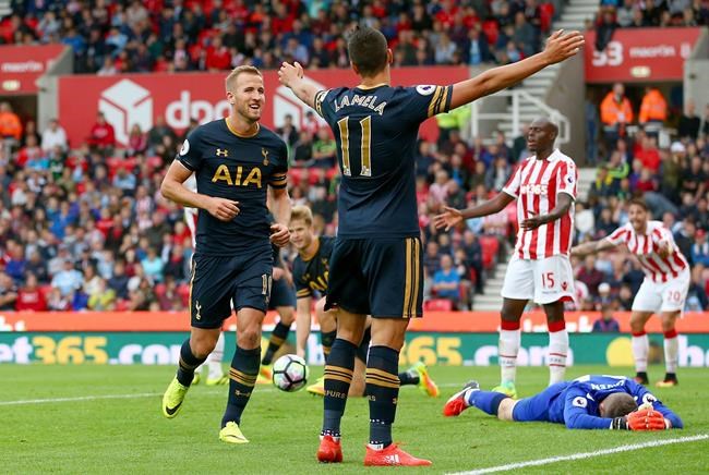 Tottenham Hotspur's Harry Kane left celebrates scoring against Stoke City during the English Premier League soccer match at The Bet365 Stadium Stoke-on-Trent England Saturday Sept. 10 2016