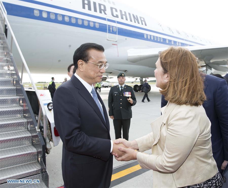 Chinese Premier Li Keqiang and his wife Cheng Hong are welcomed by Canadian senior officials upon their arrival at Ottawa Canada Sept. 21 2016. At the invitation of his Canadian counterpart Justin Trudeau Chinese Premier Li Keqiang arrived here We