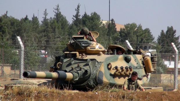 A Turkish army tank is stationed near the Syrian border in Suruc Turkey on Sept. 3. Turkish tanks crossed into Syria on Saturday to support Syrian rebels against ISIS according to the Anadolu news agency