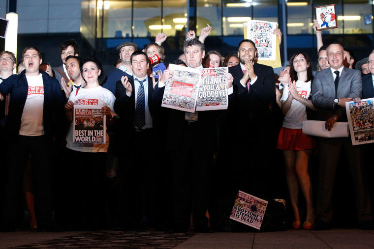 Former News of The World editor Colin Myler leads staff and journalists out of the News International offices after preparing the last edition of the paper in July 2011. He has been found be in contempt of Parliament by giving misleading evidence