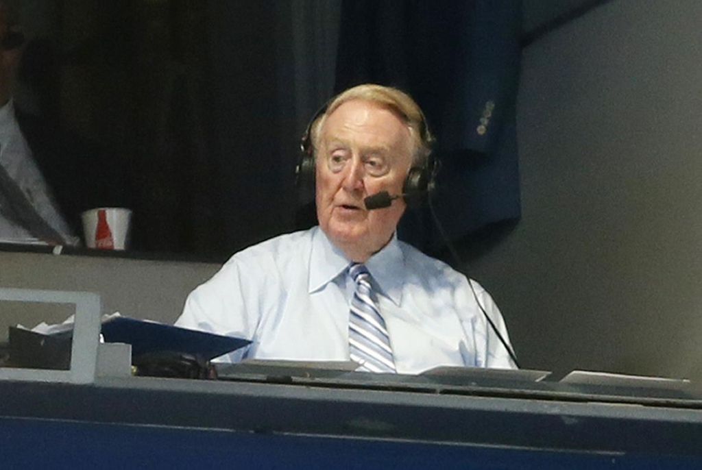 Vin Scully broadcasts from a press box booth at Dodger Stadium DANNY MOLOSHOK  DANNY MOLOSHOK THE ASSOCIATED PRESS