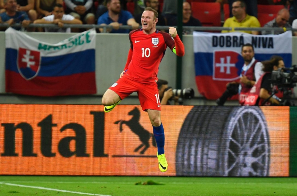 England's Wayne Rooney celebrates his team's winning goal during World Cup qualifying play against Slovakia on Sunday