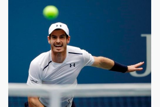 Andy Murray of the United Kingdom returns a shot to Paolo Lorenzi of Italy during the third round of the U.S. Open tennis tournament Saturday Sept. 3 2016 in New York