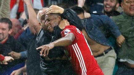 Marcus Rashford is mobbed by fans after scoring the winner at Hull