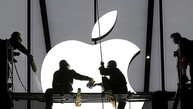 Workers prepare for the opening of an Apple store in Hangzhou Zhejiang province