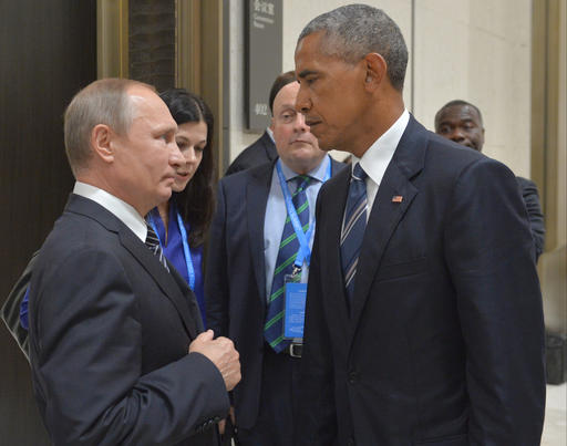 Russian President Vladimir Putin left speaks with U.S. President Barack Obama in Hangzhou in eastern China's Zhejiang province Monday Sept. 5 2016