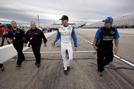 Carl Edwards acknowledges supporters after winning the pole position for Sunday's NASCAR Sprint Cup Series auto race at New Hampshire Motor Speedway Friday Sept. 23 2016 in Loudon N.H