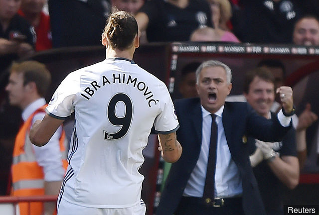 Manchester United's Zlatan Ibrahimovic celebrates scoring their third goal manager Jose Mourinho