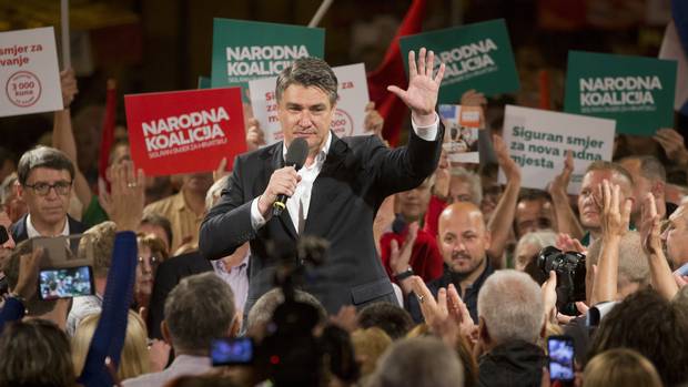 Zoran Milanovic leader of the centre-left coalition greets supporters at a rally in Zagreb ahead of the election