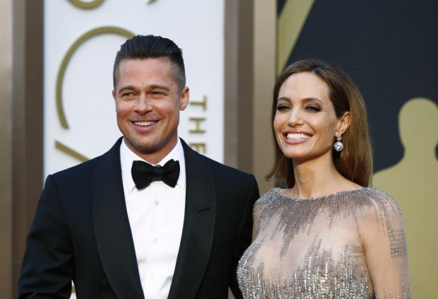 Actors Brad Pitt and Angelina Jolie arrive at the 86th Academy Awards in Hollywood California