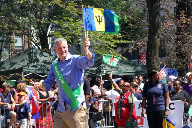 Mayor Bill de Blasio foreground makes his way along Eastern Parkway in the Brooklyn borough of New York as he takes part in the West Indian Day Parade. For years there have been complaints about safety at J&#03