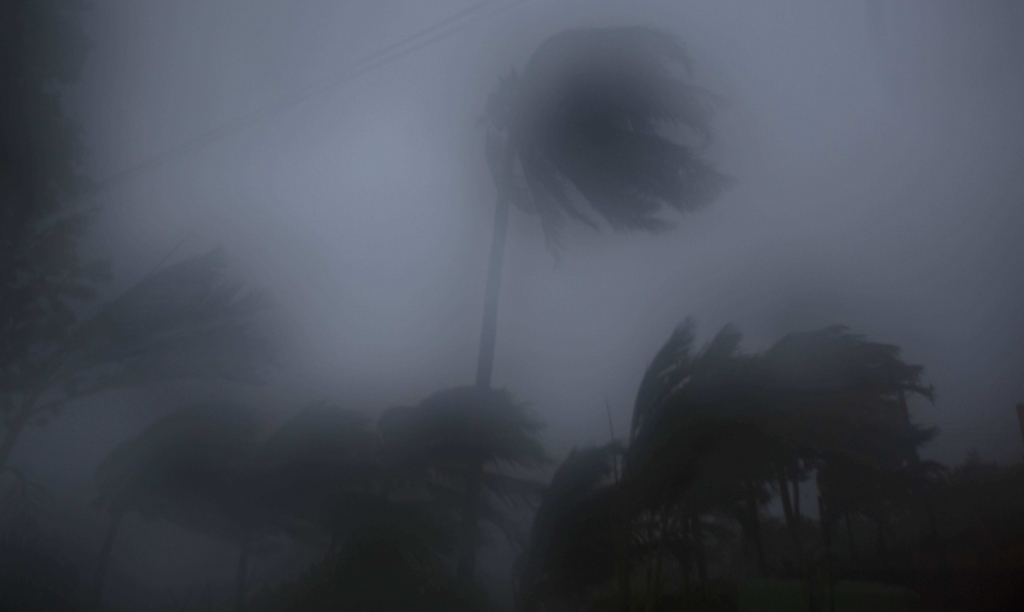 The high winds and rain of Hurricane Matthew roar over Baracoa Cuba Tuesday Oct. 4 2016. The dangerous Category 4 storm blew ashore around dawn in Haiti. It unloaded heavy rain as it swirled on toward a lightly populated part of Cuba and the Bahamas