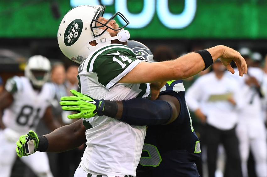 Oct 2 2016 East Rutherford NJ USA New York Jets quarterback Ryan Fitzpatrick gets hit by Seattle Seahawks defensive end Frank Clark in the first quarter at Met Life Stadium. Mandatory Credit Robert Deutsch-USA TODAY Sports