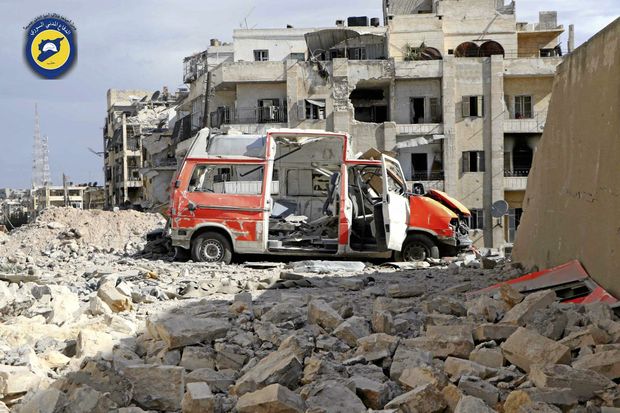 CARNAGE A destroyed ambulance outside the Syrian Civil Defence centre after air strikes in Ansari neighbo Urhood in Aleppo Syria