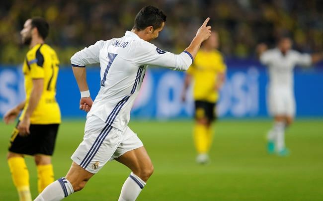 Real Madrid's Cristiano Ronaldo celebrates scoring the opening goal during the Champions League group F soccer match between Borussia Dortmund and Real Madrid in Dortmund Germany Tuesday Sept. 27 2016