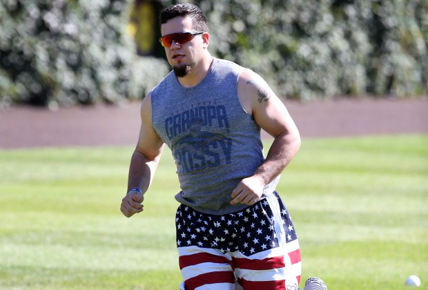 Last year's post-season hero saluted America and his teammate Grandpa Rossy while testing out his knee at Wrigley Field in September