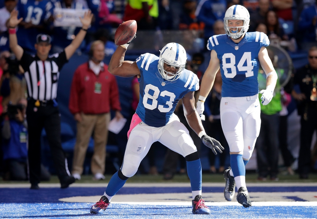 INDIANAPOLIS IN- OCTOBER 09 Dwayne Allen #83 of the Indianapolis Colts celebrates after scoring a touchdown during the game against the Chicago Bears at Lucas Oil Stadium