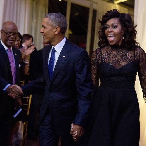 Michelle Obama and President Barack Obama arrive at a BET event on the South Lawn of the White House in Washington Friday Oct. 21 2016