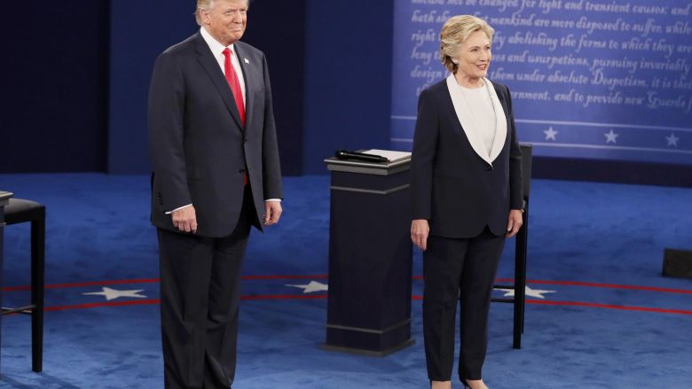 Republican U.S. presidential nominee Donald Trump and Democratic U.S. presidential nominee Hillary Clinton enter the town hall debate at Washington University in St. Louis Missouri U.S. REUTERS  Shannon Stapleton