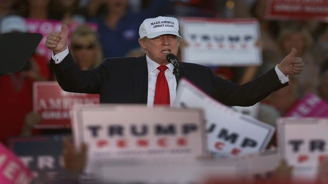 LAKELAND FL- OCTOBER 12 Republican presidential candidate Donald Trump takes to the stage to speak during a campaign rally at the Lakeland Linder Regional Airport