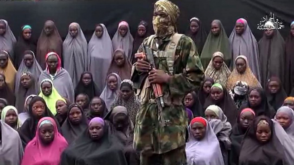 This image created on Aug. 14 taken from a video released on You Tube purportedly by Boko Haram shows the militants at an undisclosed location standing in front of girls allegedly kidnapped from Chibok in April 2014