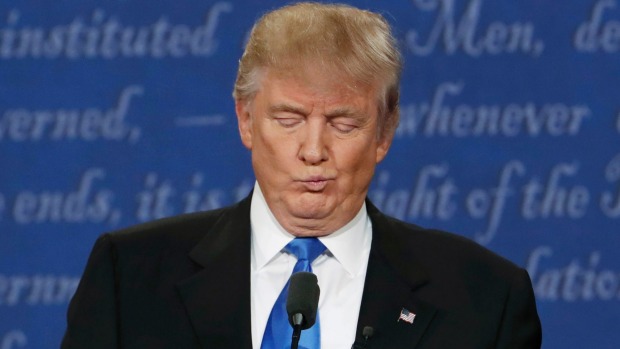 Donald Trump reacts during the first presidential debate