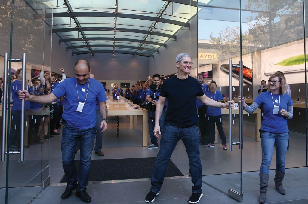 Tim Cook as he opens the door to an Apple Store to begin sales of the new iPhone 6 on Sept. 19 2014 in Palo Alto Calif. Apple could open retail stores in India soon