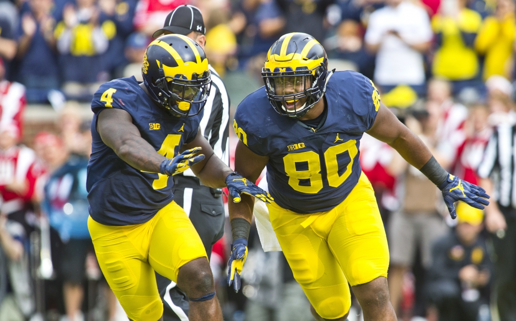 Michigan running back De'Veon Smith celebrates with fullback Khalid Hill after Hill scored a touchdown in the second quarter of an NCAA college football game against Wisconsin at Michigan Stadium in Ann Arbor Mich. Saturday Oct. 1 2016