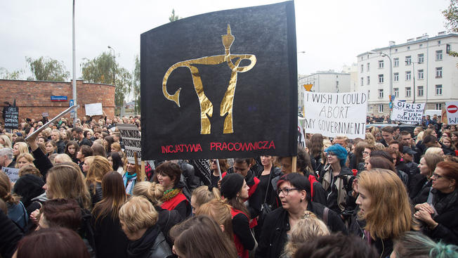 Polish women strike to signify grief in terms of the abortion ban in Poland Oct. 3 2016 in Warsaw