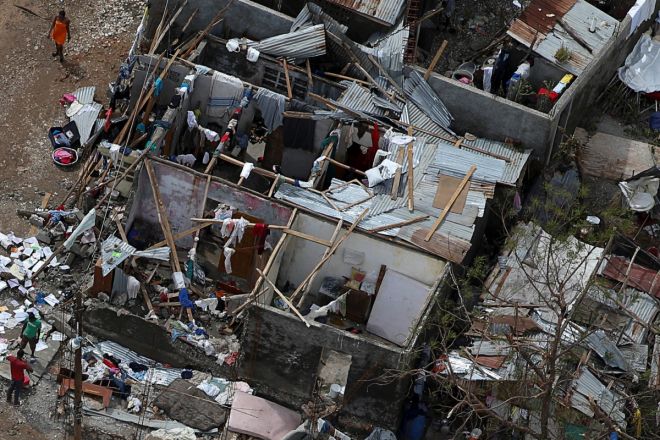 People try to rebuild their destroyed houses after Hurricane Matthew passes Jeremie Haiti					 Reuters