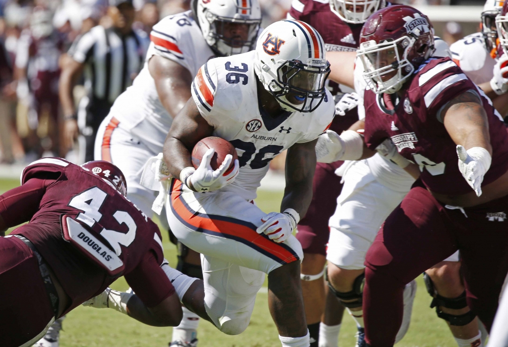 Auburn running back Kamryn Pettway rushes for a first down in the first half of their NCAA college football game against Mississippi State Saturday Oct. 8 2016 in Starkville Miss