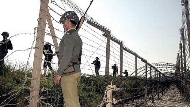 Army soldiers stand guard at the Indo Pak border in Jammu and Kashmir