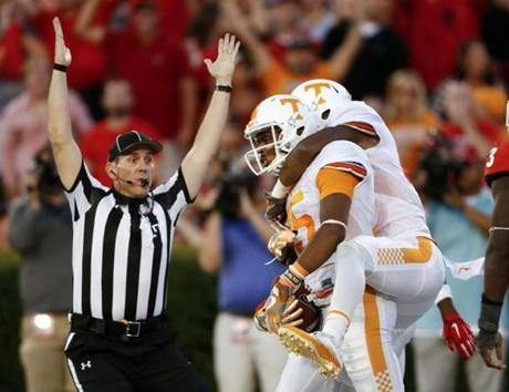 Tennessee’s Jauan Jennings held the ball and teammate Josh Malone after he beat Georgia with a last-second touchdown