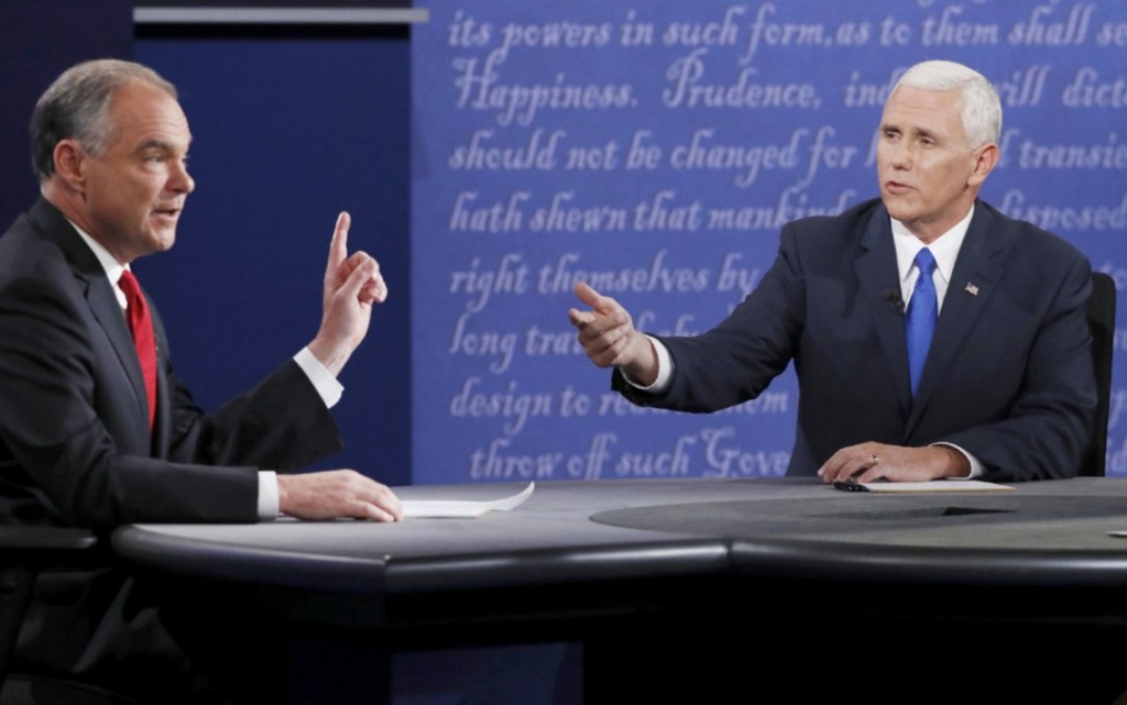 Democratic U.S. vice-presidential nominee Senator Tim Kaine left and Republican U.S. vice-presidential nominee Governor Mike Pence debate on Tuesday