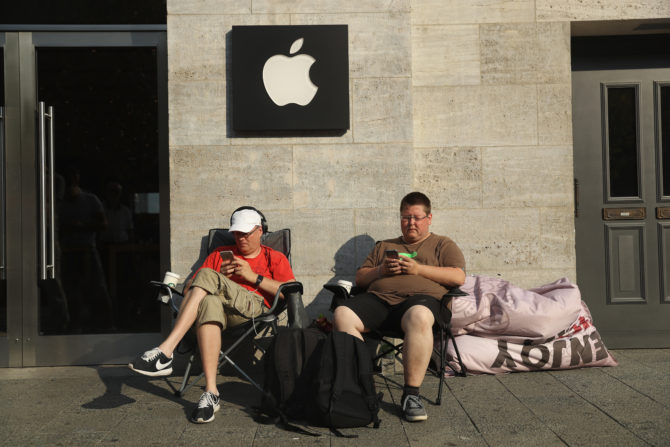 Two Apple fans camping out in front of the Apple Store in Berlin Germany