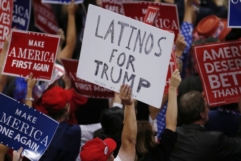 A person holds a sign reading Latinos for Trump on the third day of the Republican National Convention in Cleveland Ohio