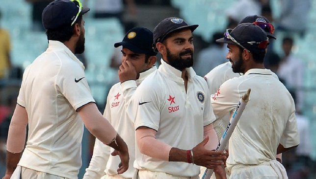 Virat Kohli and the Indian team celebrate after defeating New Zealand