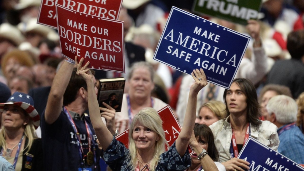 A delegate holds signs at the Republican National Convention in Cleveland