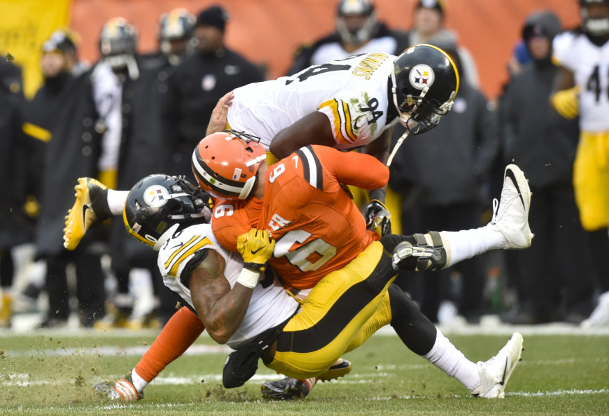 Pittsburgh Steelers inside linebacker Lawrence Timmons hits Cleveland Browns quarterback Cody Kessler as Kessler is tackled by inside linebacker Ryan Shazier in the third quarter of an NFL football game in Cleveland Sunday Nov. 20 2016. T