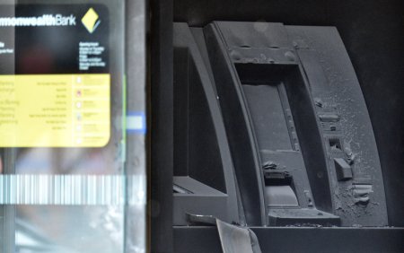 An electronic cash machine is burned at a branch of the Commonwealth Bank after a fire injured customers in Melbourne Australia