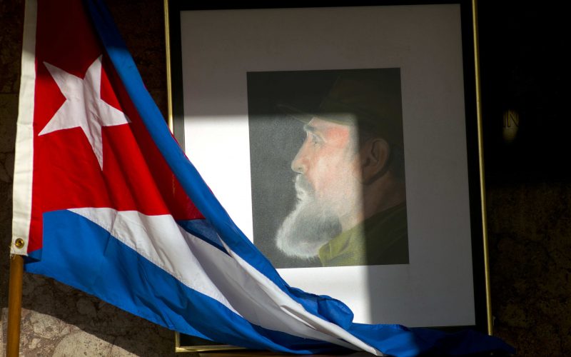 An image of Fidel Castro and a Cuban flag are displayed in honour of Castro inside the foreign ministry in Havana