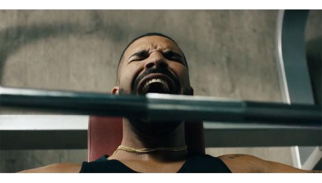 Drake Hurts Himself on Bench Press Singing Taylor Swift in New Apple Music Commercial