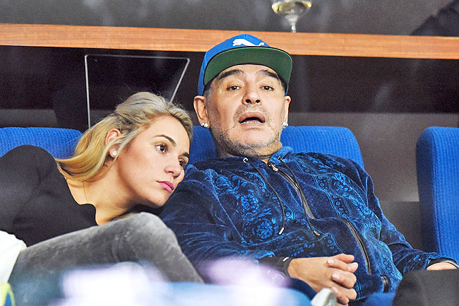 Argentinian retired professional footballer Diego Armando Maradona and his girlfriend Rocio Olive attend the Davis Cup World Group final singles match