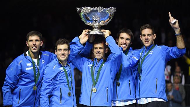 Leonardo Mayer Guido Pella Federico Delbonis Juan Martin del Potro and coach Daniel Orsanic celebrate with the trophy after winning the Davis Cup World Group final between Croatia and Argentina