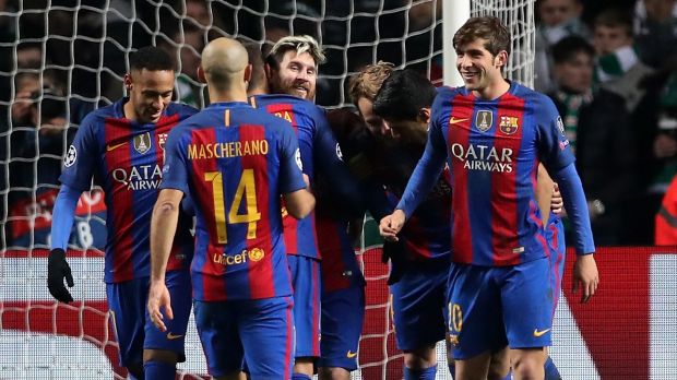 Lionel Messi celebrates a goal with his Barcelona teammates