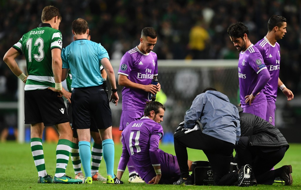 Real Madrid's Welsh forward Gareth Bale is checked by medics during the UEFA Champions League football match Sporting CP vs Real Madrid CF at the Jose Alvalade stadium in Lisbon