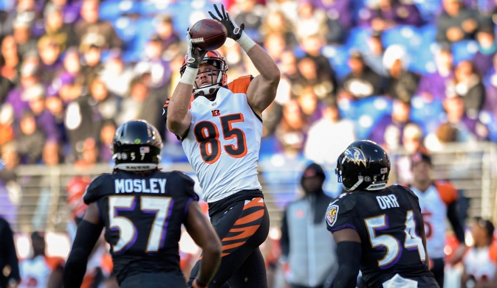 Cincinnati Bengals tight end Tyler Eifert leaps over Baltimore Ravens inside linebacker C.J. Mosley an dinside linebacker Zach Orr to pull in a pass during the second half of an NFL football game in Baltimore Sunday Nov. 27 2016. (AP Pho