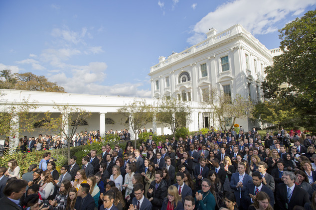 White House staff members applaud in the Rose Garden of the White House in Washington after listening to President Barack Obama