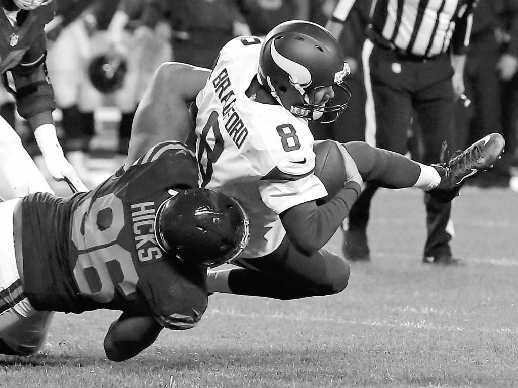 Chicago Bears defensive end Akiem Hicks sacks Minnesota Vikings quarterback Sam Bradford during the first half of the Bears’ 20-10 victory on Monday night